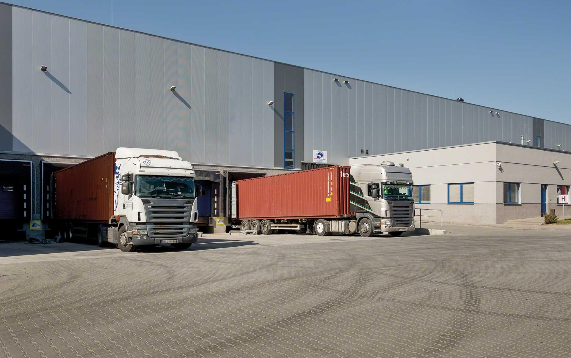 Lorries loading and unloading goods at the warehouse docks