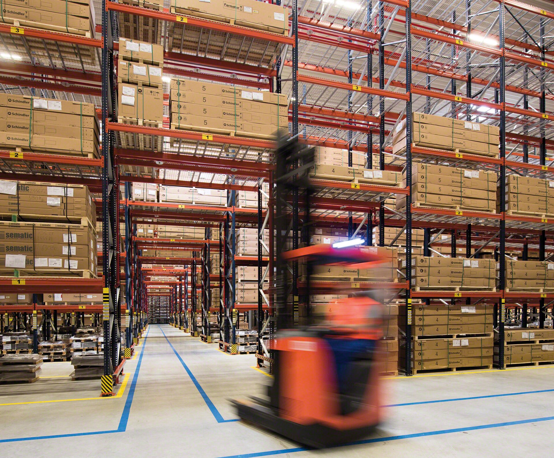 Ground-level passageways allow forklift operators to drive through the pallet racking