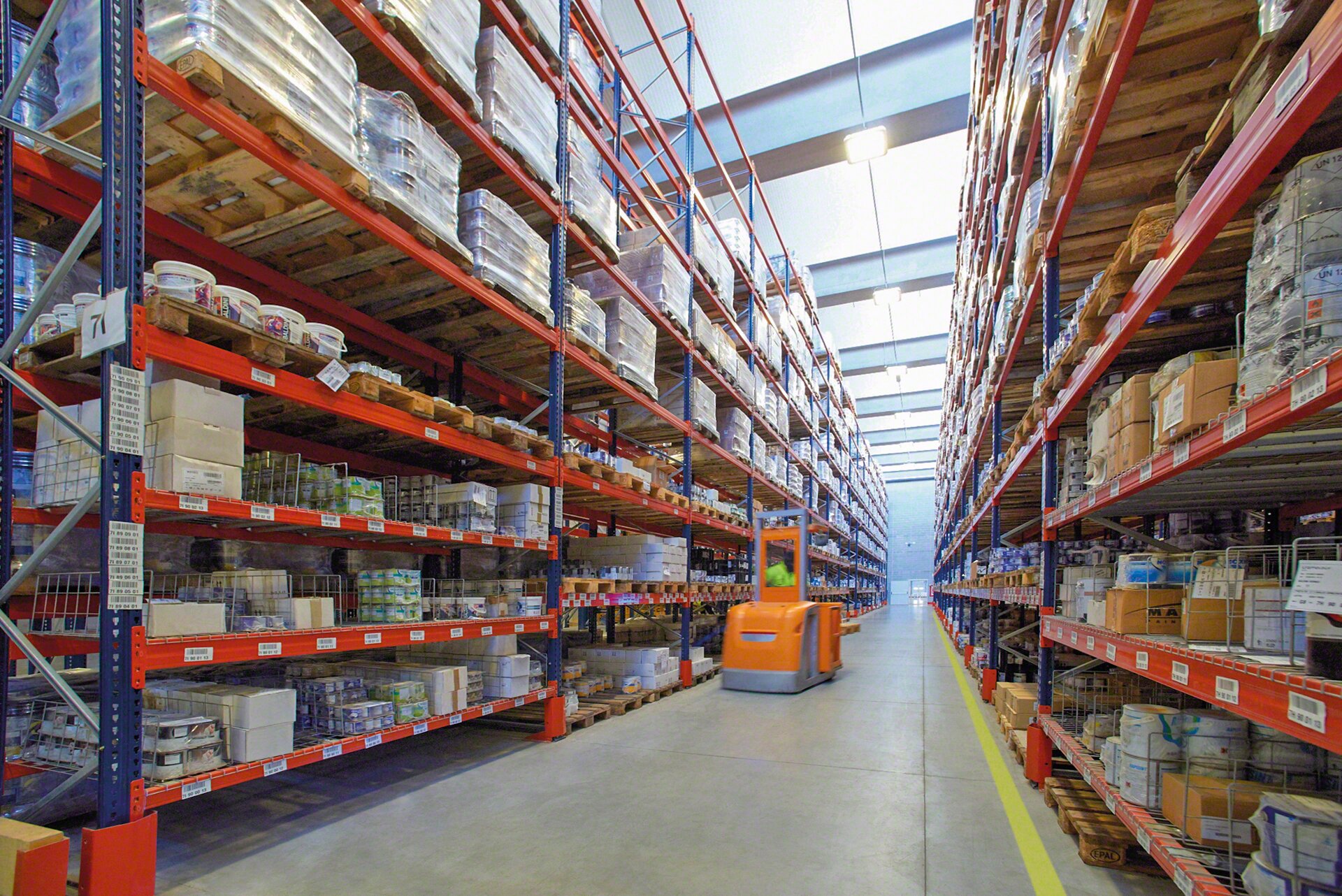 Pallet rack with shelving on the lower levels for order picking