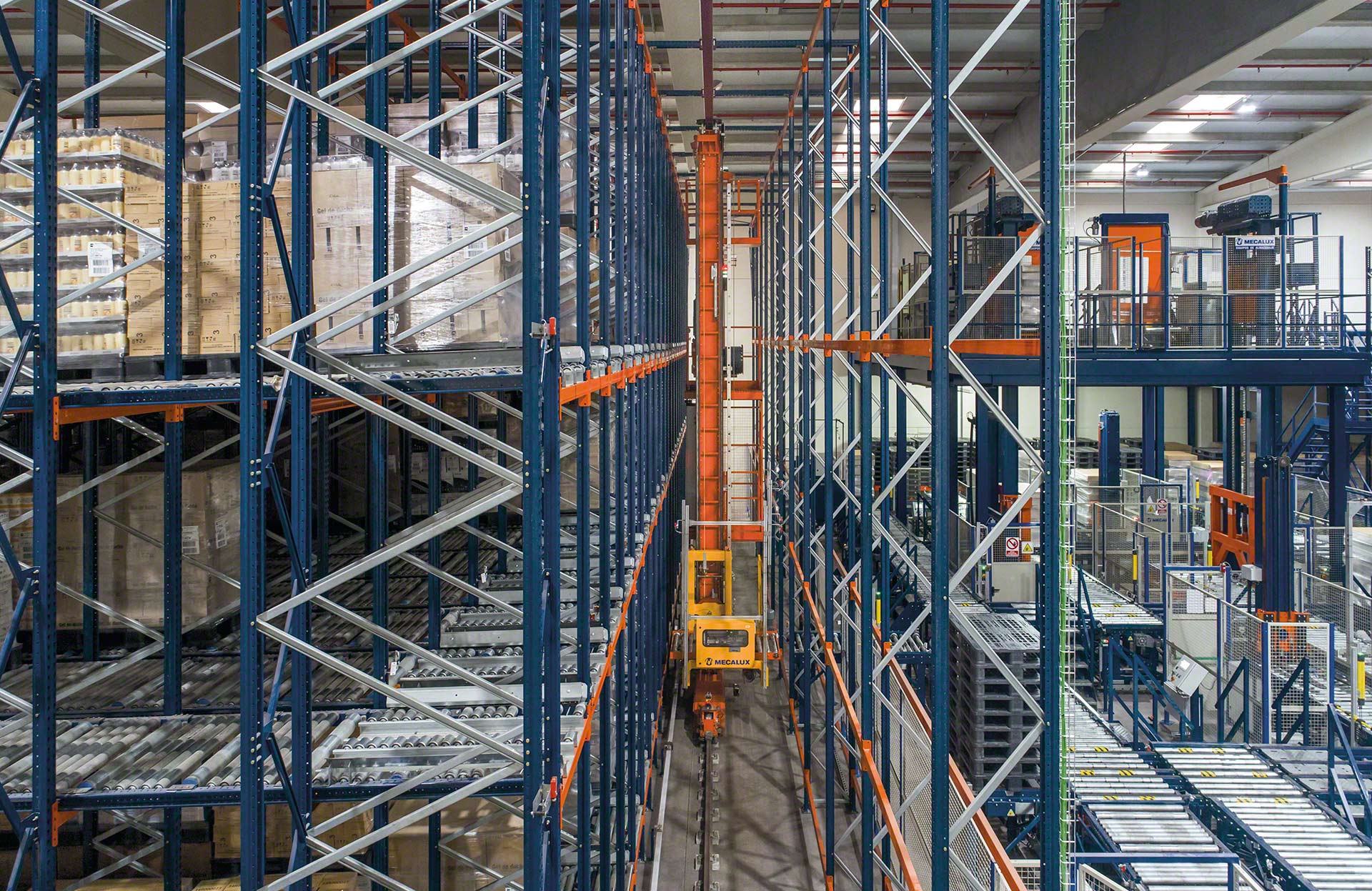 Stacker cranes can be used in conjunction with conveyors to automate pallet transport
